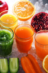 Glasses with fresh organic vegetable and fruit juices
