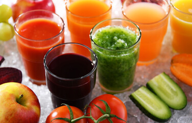 Glasses with fresh organic vegetable and fruit juices