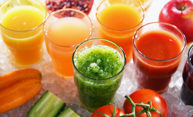 Glasses with fresh organic vegetable and fruit juices