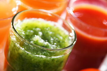 Glasses with fresh organic vegetable and fruit juices