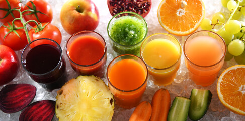Glasses with fresh organic vegetable and fruit juices