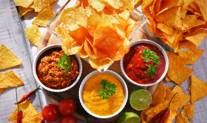 Composition with bowl of tortilla chips.