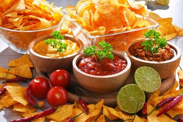 Composition with bowl of tortilla chips.