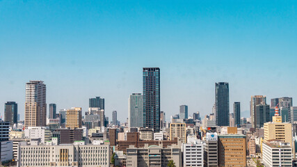 Fototapeta premium An aerial or high view of Osaka city, Japan. Taken from the Osaka Castle in the afternoon