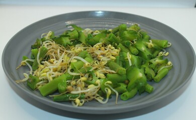 green vegetables and sprouts in a plate