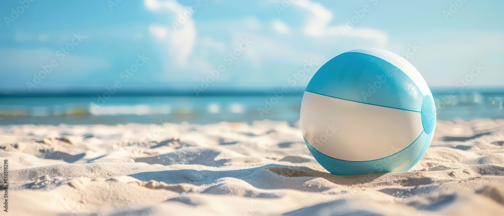 Wall mural wallpaper with a inflatable beach ball on the sand, beautiful vacation background 