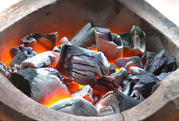 The charcoal grill is hot and ready to cook.