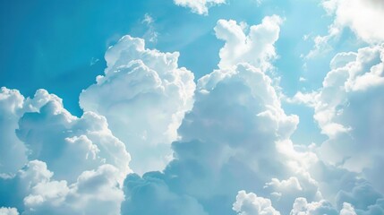 Naklejka premium Light blue sky with fluffy white clouds, offering plenty of room for text