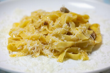 Traditional carbonara noodles on white plate