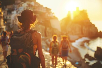Fototapeta premium Many people walking along the beach at sunset, travel background