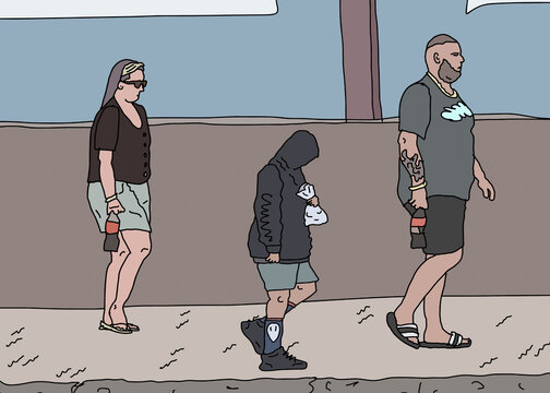 Family of three in dark clothing walking along footpath carrying food and drinks