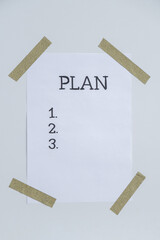 Motivational paper note PLAN. Goals setting concept. Strategy for self development improvement....