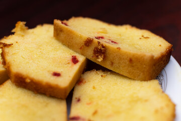 Plain cake with cherry fruit.