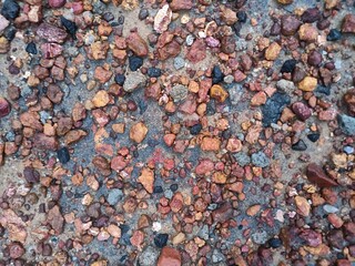 stone and small rock on the ground