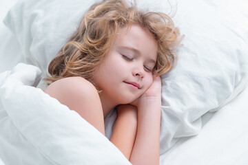 Little boy sleeps. Kid take nap. Child sleeping in bed, comfortable mattress on bedroom. Healthy...