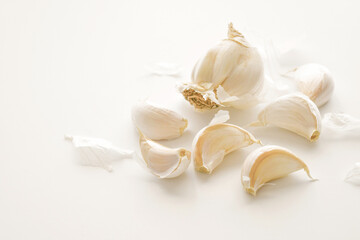 Garlic bulb and clove on the table.