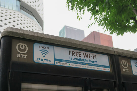 NTT Free Wi-Fi sign on a phone booth in Ginza, Tokyo, Japan. May 19, 2024