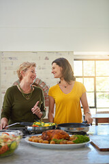 Elderly woman, daughter and cooking in kitchen with laughing, bonding and healthy meal with funny...