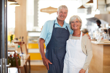 Senior, couple and portrait in restaurant business with smile, embrace and ready for hospitality...