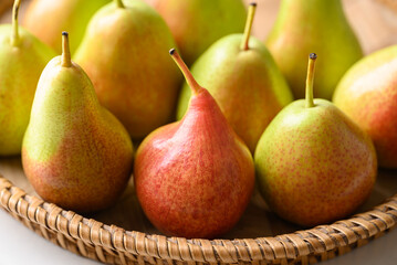 Fresh pear fruit in natural basket, Healthy fruit