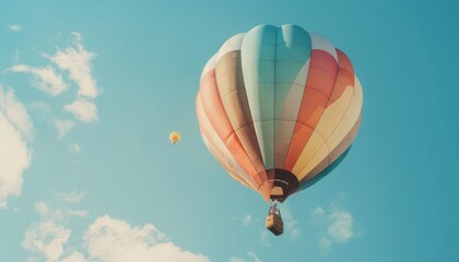 Fototapeta premium Floating High: A Vibrant Hot Air Balloon Soaring Across the Sky