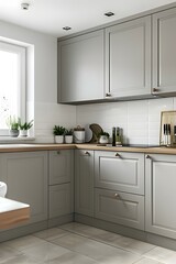 A kitchen in Scandinavian style, with white walls and light gray cabinets