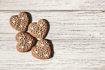Homemade cookies in the shape of hearts with snowflakes