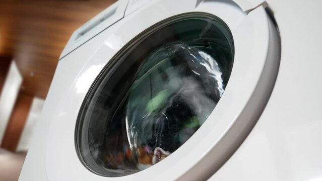 Сlose-up of washable clothes in the drum of a home washing machine