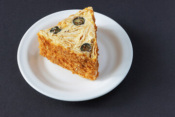 Chopped dough roll with whipped cream and blueberries on a plate