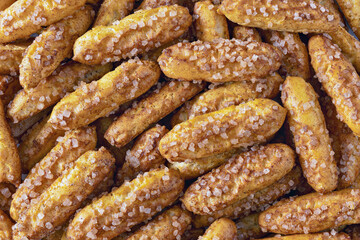 Cookies with sugar and cinnamon as a background