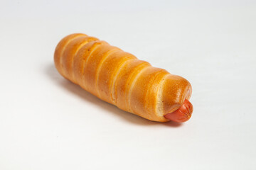 Sausage in the dough isolated on a white background.