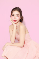 Pretty Asian beauty woman with Korean makeup glowing face and healthy facial skin portrait smile on...