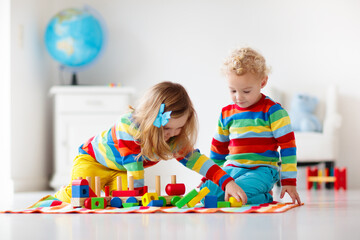 Kids playing with wooden toy train