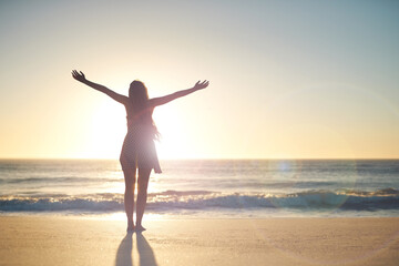 Woman, hands up and goal with silhouette at beach with sunset sky, mock up space and celebration....