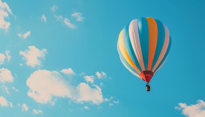 Naklejka premium Vibrant Journey: A Colorful Hot Air Balloon Soaring Through the Blue Skies