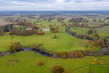 Obraz premium Aerial photo of the British village of Little Ribston which is a civil parish in the Harrogate district of North Yorkshire in Leeds showing the typical country side on a cold day in the Autumn
