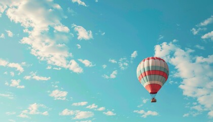 Obraz premium A Vibrant Journey: The Colorful Hot Air Balloon Soaring through the Blue Sky with White Clouds, AR 7