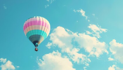 Fototapeta premium Circling the Clouds: A Vibrant Hot Air Balloon Soars in the Sky