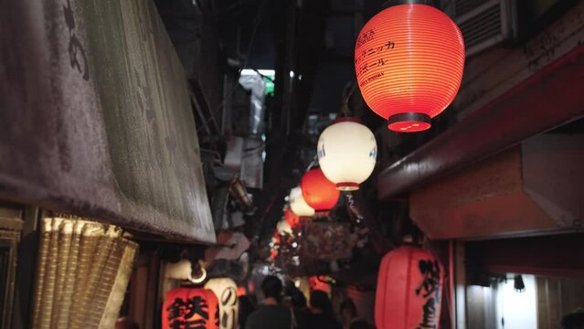 Red Lanterns Hanging in a Japanese Alleyway at Night