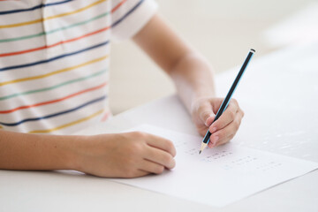 Child in school. Student in class. Boy at homework