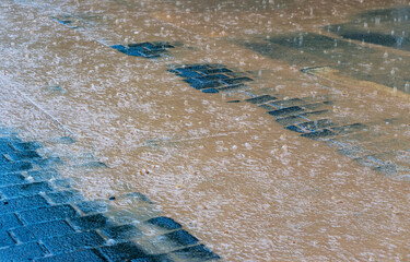 Flooded street during a storm with heavy rain in city