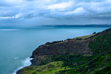 Panoramic view over Te Toto Gorge and Tasman Sea on an overcast summer day. High vantage point. Raglan, New Zealand