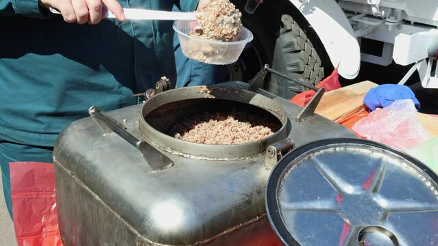 Volunteers distributing free food during a natural disaster or conflict
