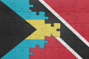 puzzle with the colourful national flag of trinidad and tobago and flag of bahamas.