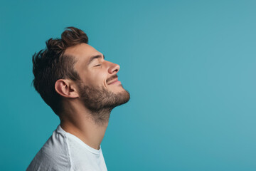 Obraz premium A close up of a man with beard and closed eyes looking to a side