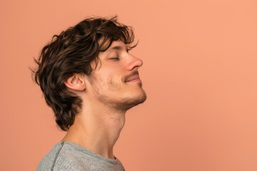 Fototapeta premium A close up of a man with beard and closed eyes looking to a side
