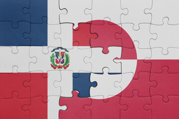 puzzle with the colourful national flag of greenland and flag of dominican republic .