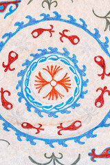 Old vintage white rug with traditional Arabic Uzbek pattern in Uzbekistan closeup