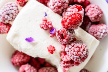 Vanilla ice cream with raspberries