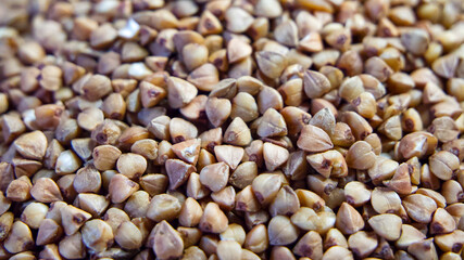 Buckwheat Texture Display. A close-up of buckwheat grains, emphasizing shape and color, great for educational materials.